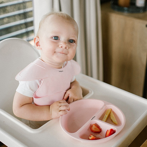 Silikónový podbradník s regulovaným zapínaním a vreckom, ružový